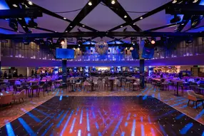 Enjoy a drink from the private purchase bar, then switch to complimentary beers, wines, and soft drinks for two hours before the main act