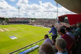 Premium padded balcony seating behind the bowlers arm