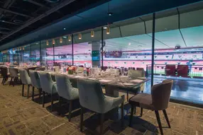 Reserved luxury padded seat in an exclusive central seating block on level one