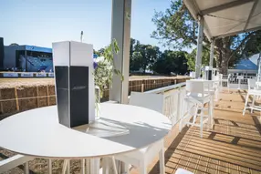 Intimate private enclosure access for the day with casual seating